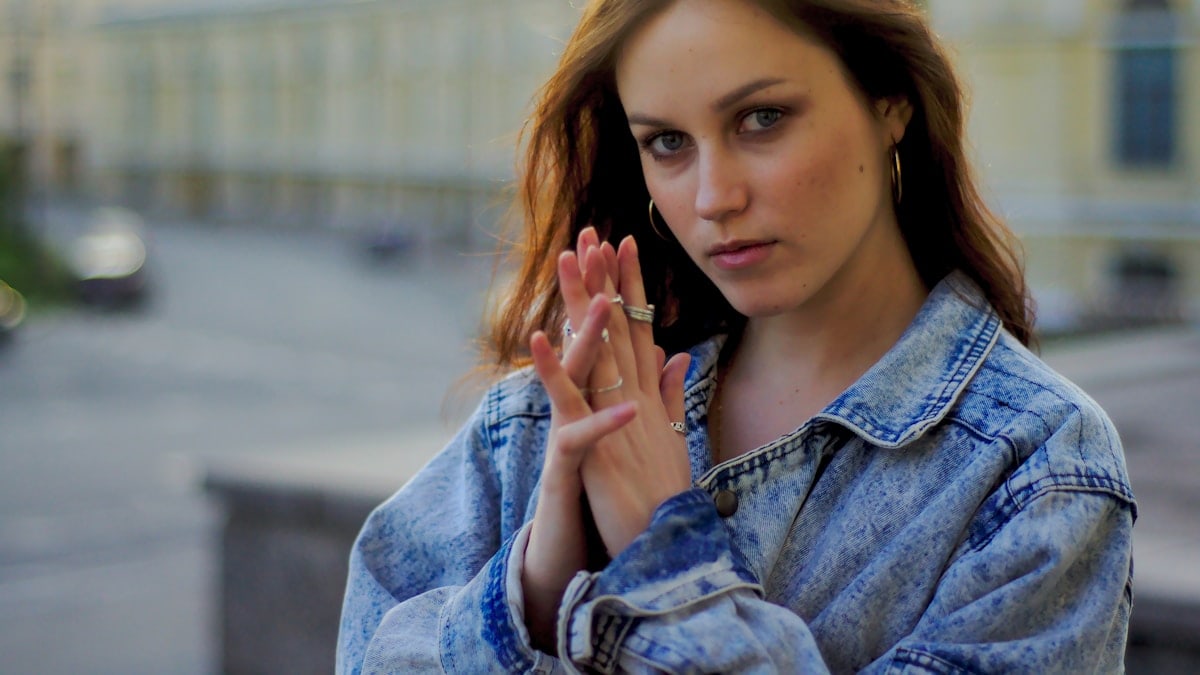 a woman with her hand on her face